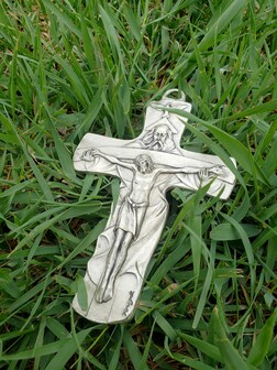 Cross laying in the grass