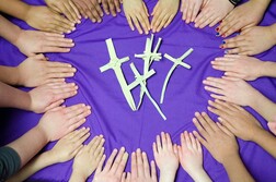 Hands with Palm Sunday crosses in the centre