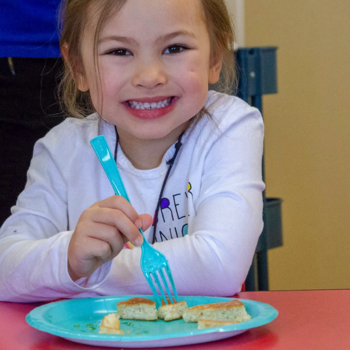 Students eating pancakes